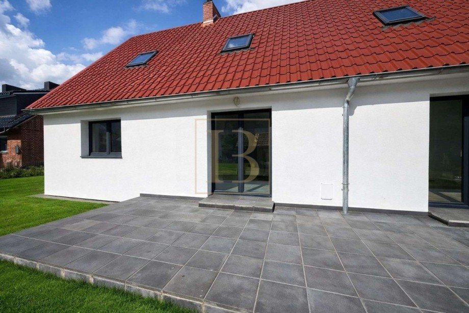 R�ckseite mit Terrasse Doppelhaush�lfte S�dheide