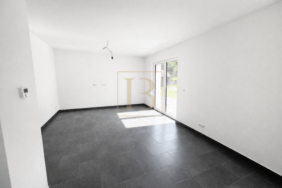 Gro�z�giger Wohnbereich mit Blick zur K�che Doppelhaush�lfte S�dheide