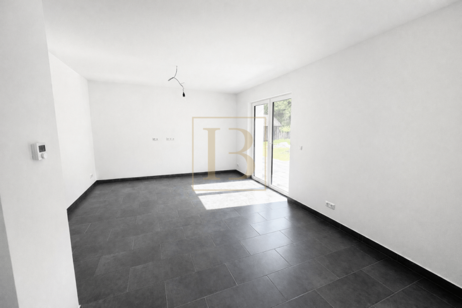 Gro�z�giger Wohnbereich mit Blick zur K�che Doppelhaush�lfte S�dheide